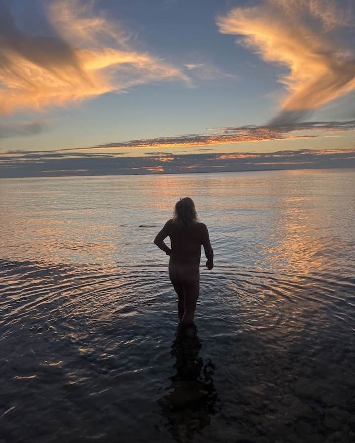 Walking into Lake Michigan at sunset, Charlevoix